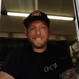Chris Kindred in the window of the CHOW food truck