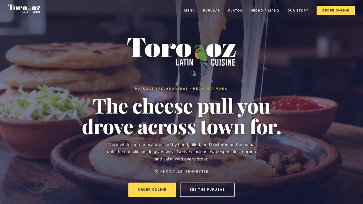 Torogoz Latin Cuisine website on a laptop